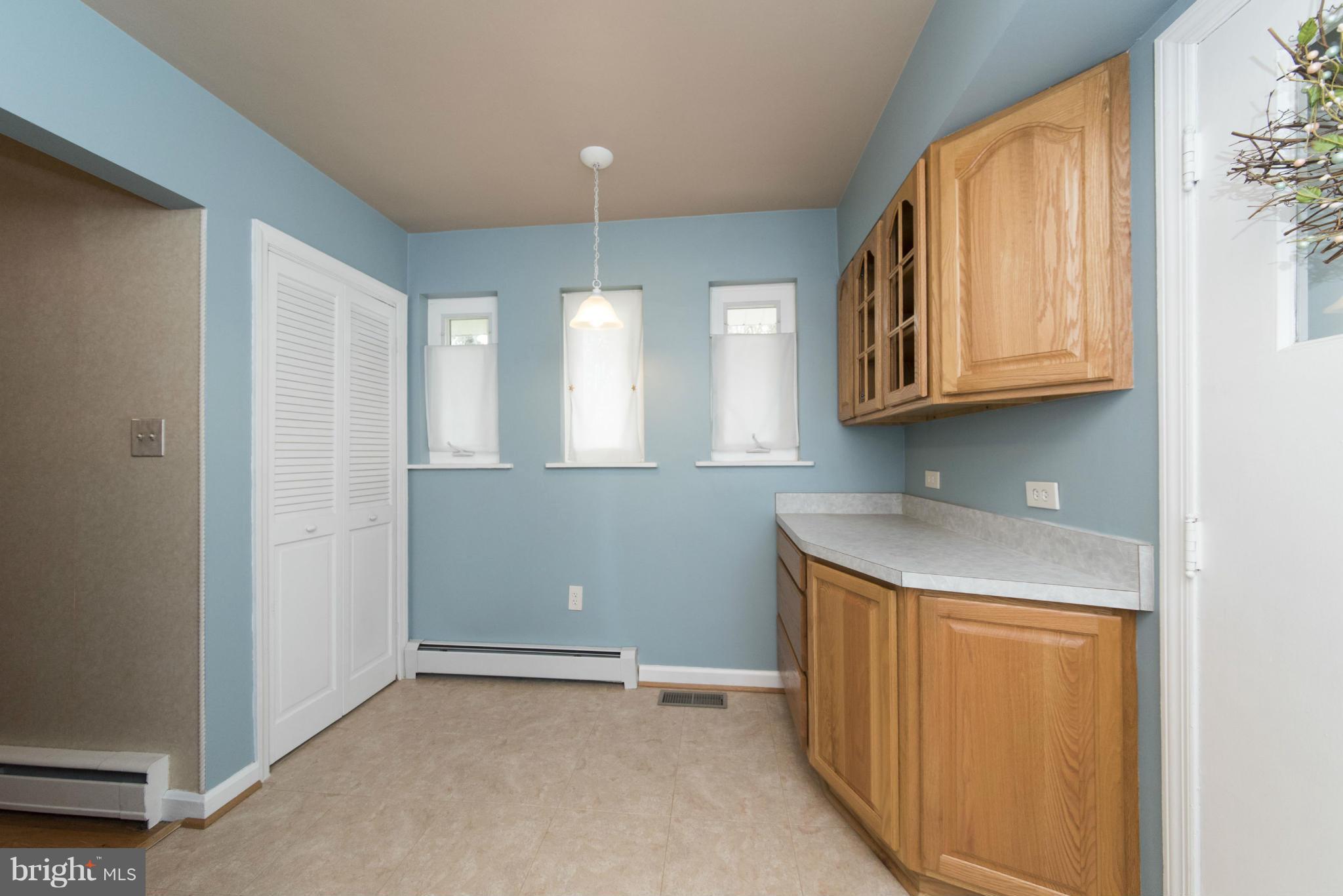 1107 Litchfield Road Baltimore, MD 21239 - Photo 12 of 30 a view of kitchen with window and cabinets