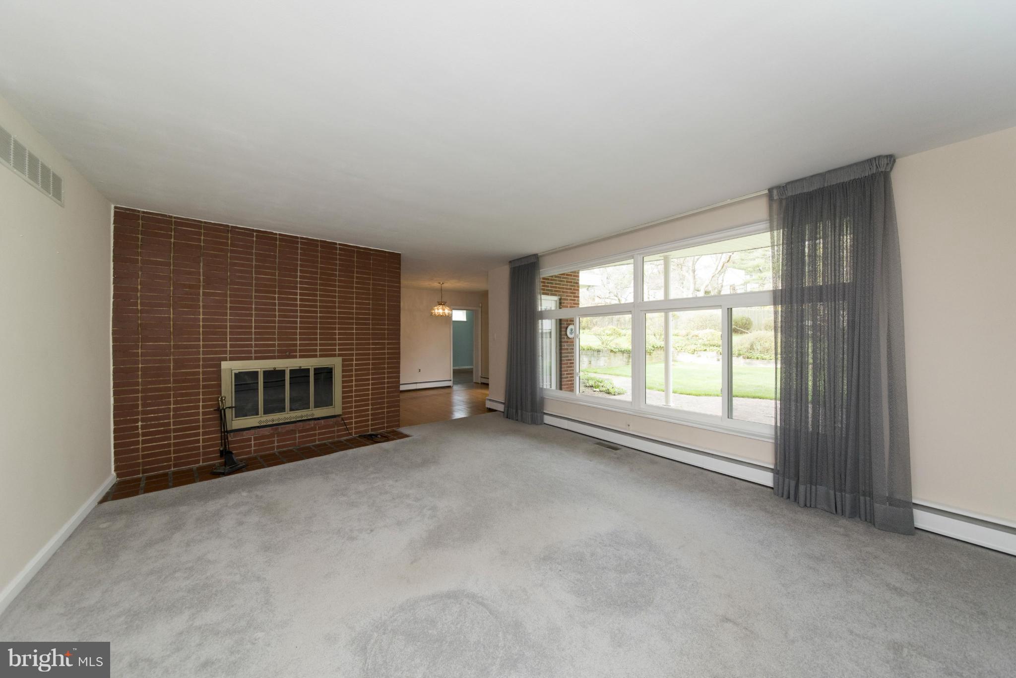 1107 Litchfield Road Baltimore, MD 21239 - Photo 3 of 30 a view of empty room with a fireplace