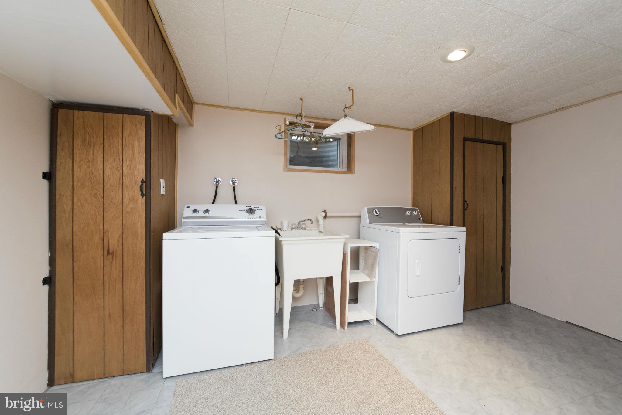 1107 Litchfield Road Baltimore, MD 21239 - Photo 26 of 30 a utility room with dryer and washer