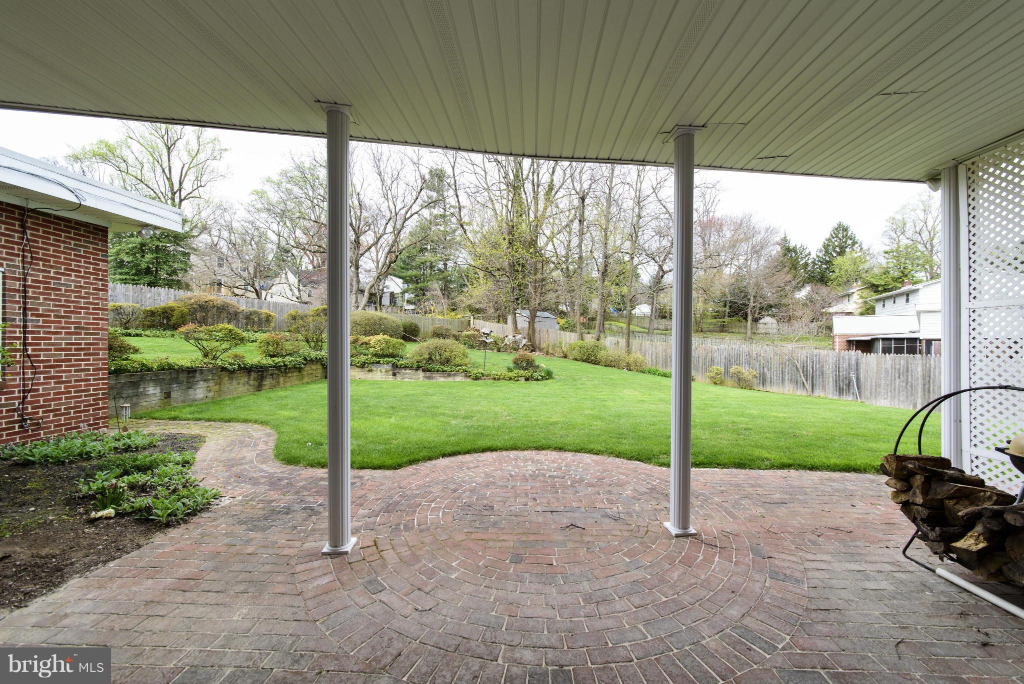 1107 Litchfield Road Baltimore, MD 21239 - Photo 28 of 30 a view of a yard with porch and tree