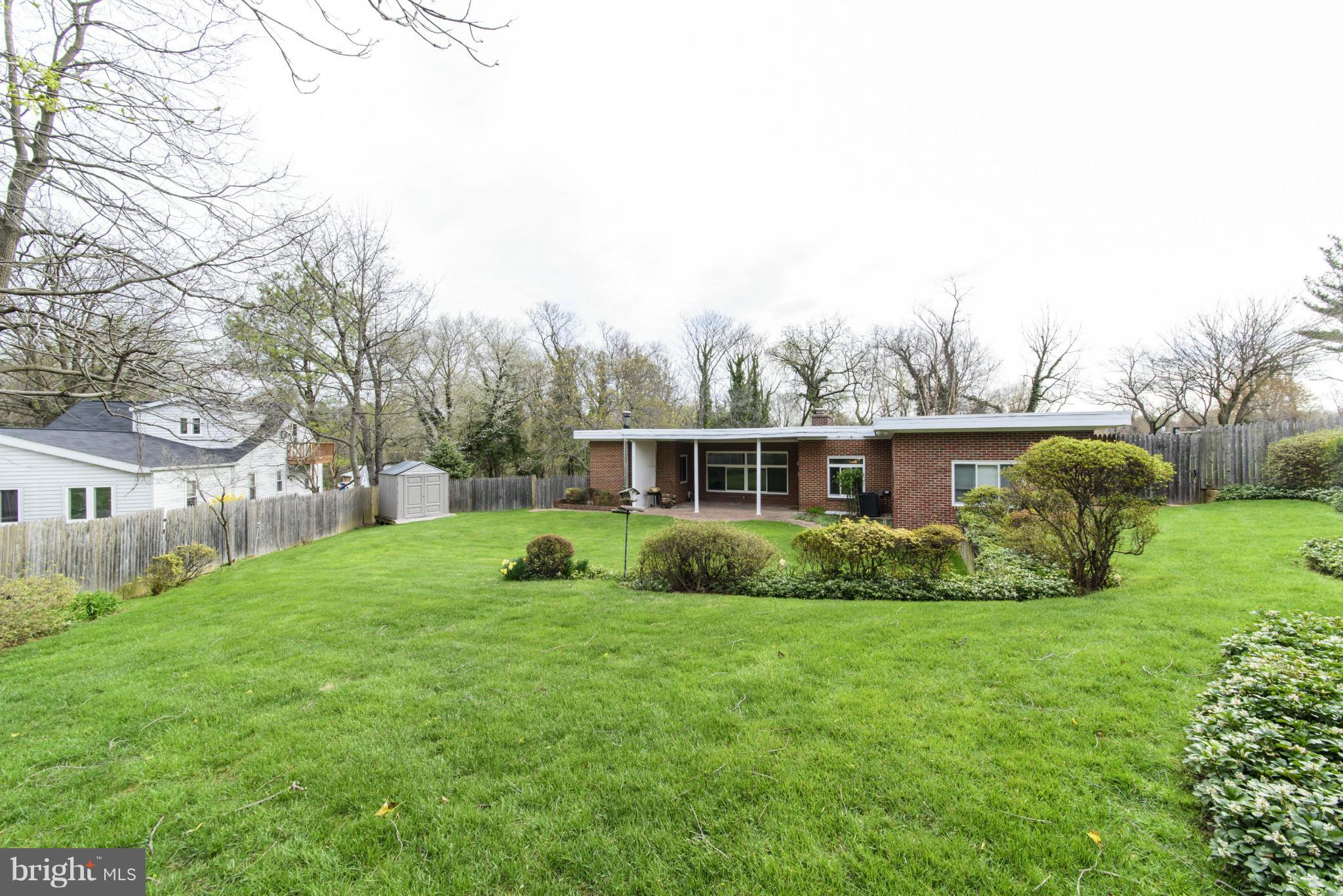 1107 Litchfield Road Baltimore, MD 21239 - Photo 29 of 30 a view of a house with a backyard