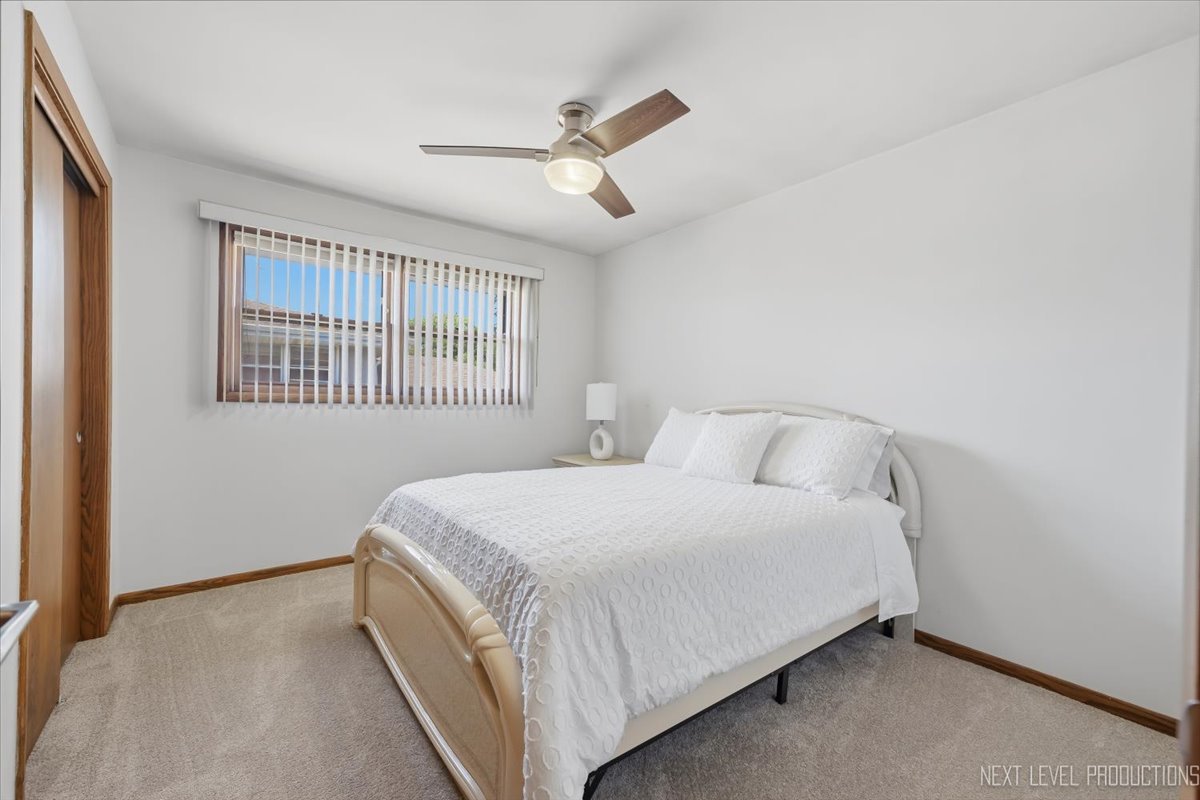 754 North Michigan Street Elmhurst, IL 60126 - Photo 19 of 32 a bedroom with a bed and a window