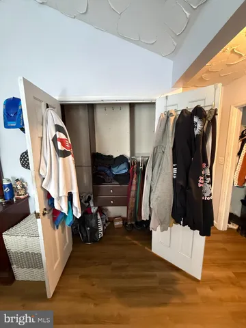 a large bathroom with a sink a mirror and a shower