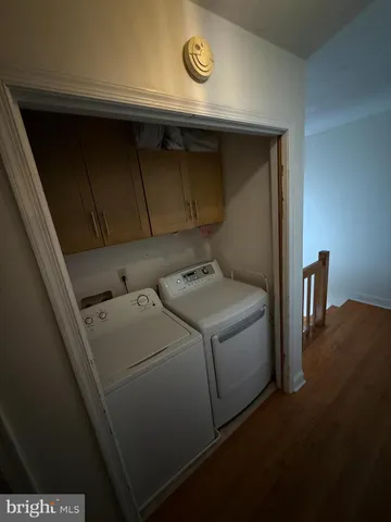 a view of staircase with wooden floor