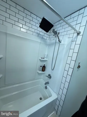 a kitchen with a refrigerator and a stove