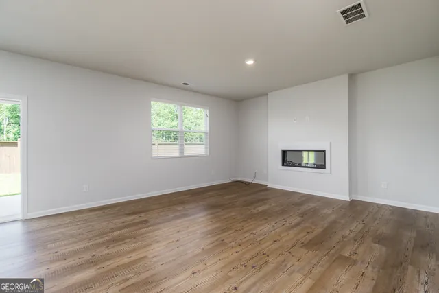a view of a kitchen with a sink and a window