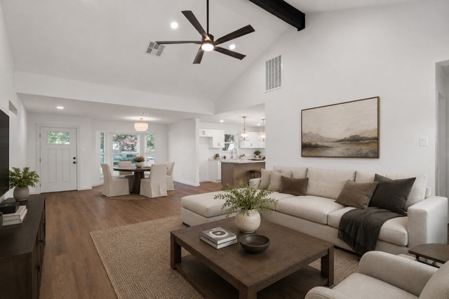 5326 Findlay Drive Pasadena, TX 77505 - Photo 7 of 50 Virtually Staged / Expansive open-concept living room featuring vaulted ceilings, exposed beam accents, luxury flooring, and abundant natural light.