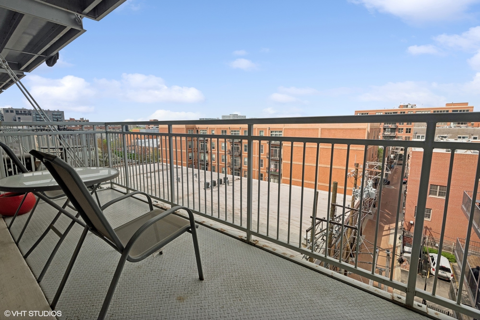 1200 West Monroe Street, Unit 619 Chicago, IL 60607 - Photo 13 of 16 a view of a balcony with furniture