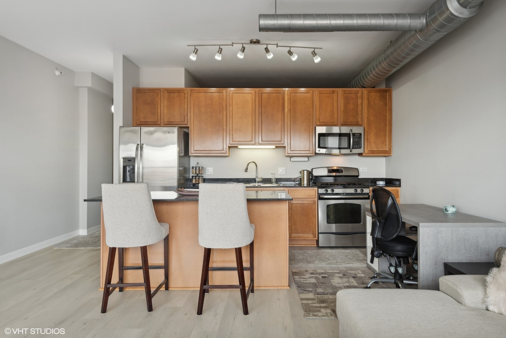 1200 West Monroe Street, Unit 619 Chicago, IL 60607 - Photo 6 of 16 a kitchen with a sink cabinets and window