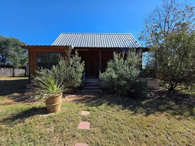a view of a backyard with plants