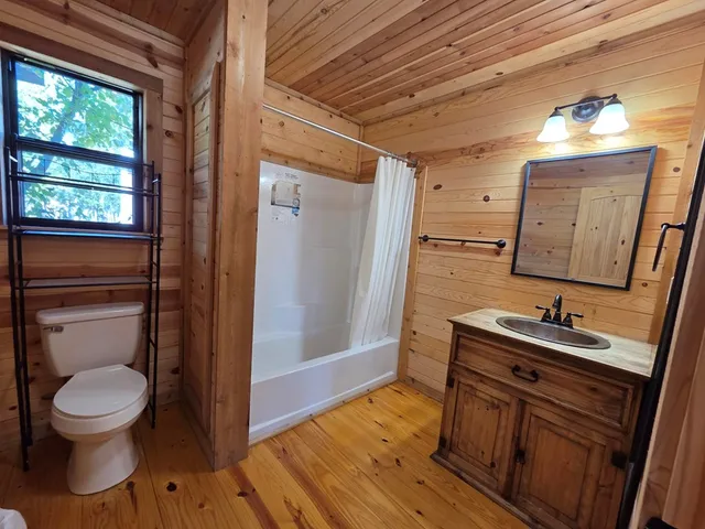 a bathroom with a bathtub and shower
