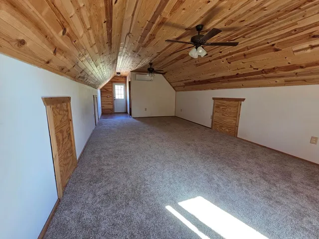 a view of deck with wooden floor and outdoor seating