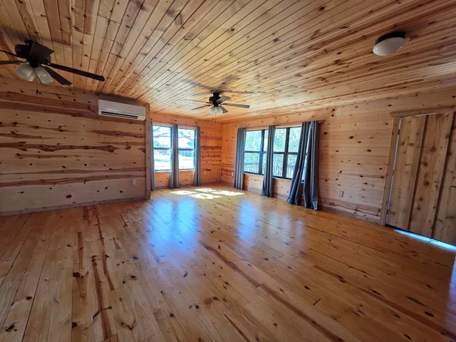 a kitchen with stainless steel appliances granite countertop a sink a stove and refrigerator