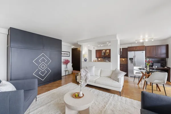 a living room with furniture and a table