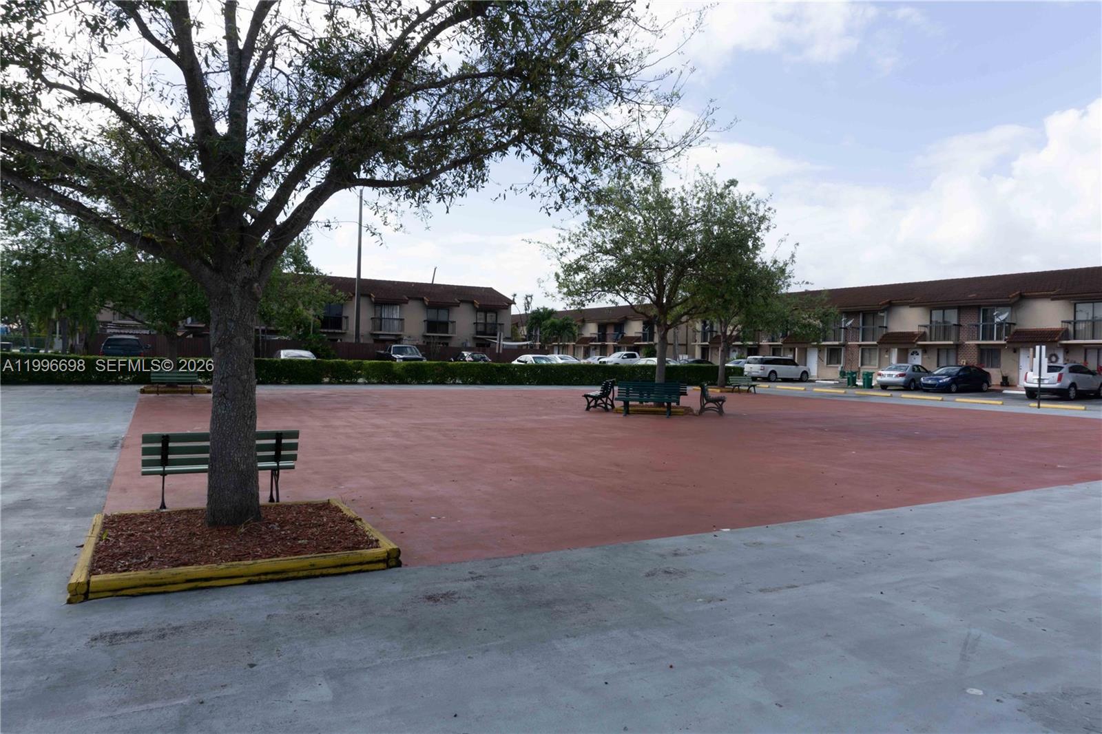 1911 Southwest 107th Avenue, Unit 1006 Miami, FL 33165 - Photo 16 of 17 a view of a park with swings and slides
