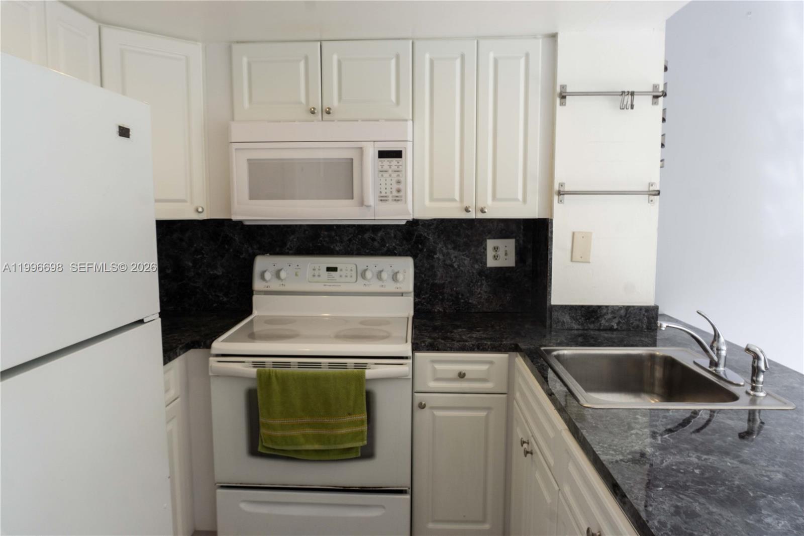 1911 Southwest 107th Avenue, Unit 1006 Miami, FL 33165 - Photo 7 of 17 a utility room with dryer and washer