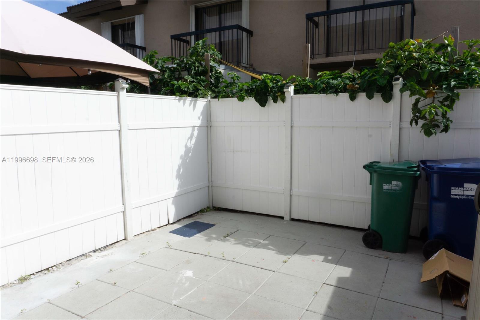 1911 Southwest 107th Avenue, Unit 1006 Miami, FL 33165 - Photo 9 of 17 a view of a backyard