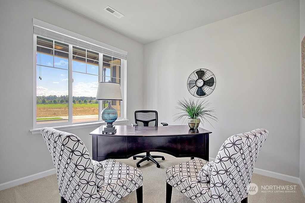 3008 Stephanie Loop Northeast Lacey, WA 98516 - Photo 4 of 5 a view of a dining room with furniture and window