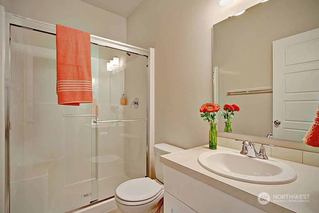 3008 Stephanie Loop Northeast Lacey, WA 98516 - Photo 5 of 5 a bathroom with a sink a toilet and shower