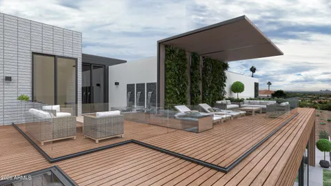 an aerial view of a house with outdoor space