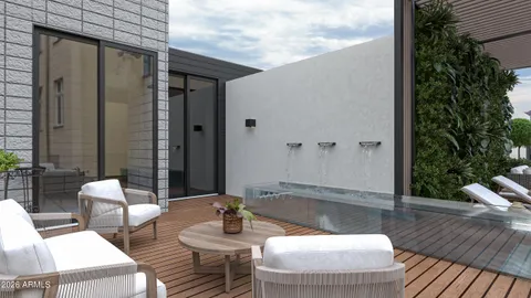 a balcony with table and chairs
