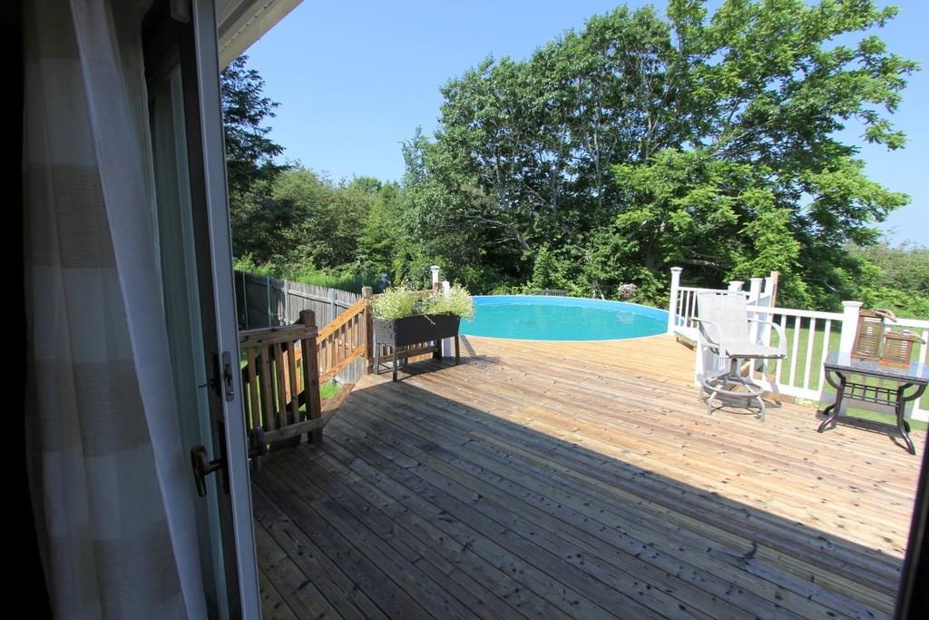 647 Wiswell Road Holden, ME 04429 - Photo 11 of 35 Expansive front deck is seamlessly...