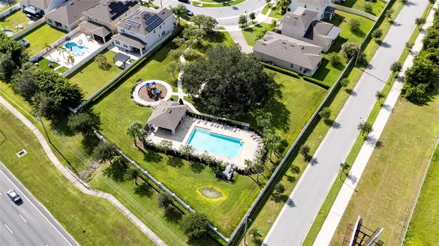 an aerial view of houses with outdoor space
