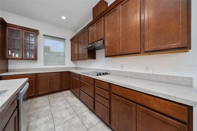 a view of a kitchen with a sink and cabinets
