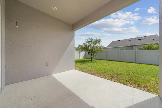 a hallway with a table and a couch