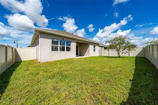 a kitchen with a stove and a refrigerator