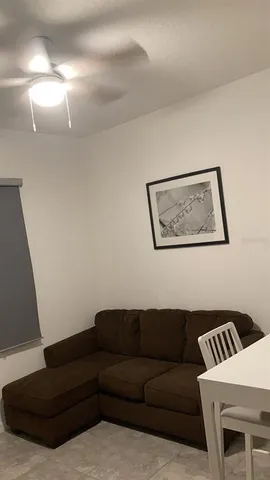 a bathroom with a granite countertop sink a toilet a mirror and shower