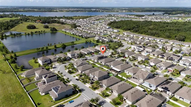 an aerial view of residential building and lake