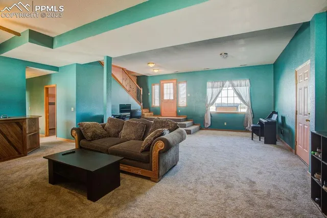 a lobby with furniture and a potted plant