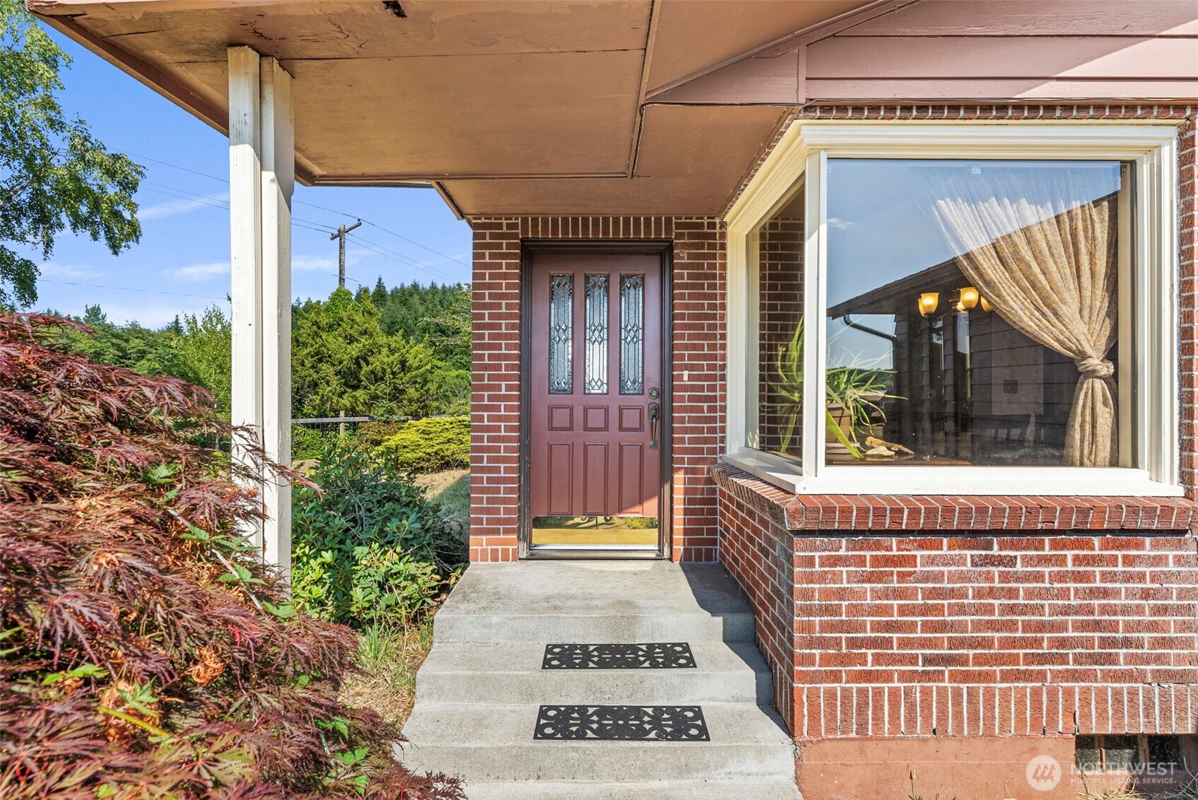 627 Wynoochee Valley Road Montesano, WA 98563 - Photo 22 of 40 a view of a brick house with a large windows