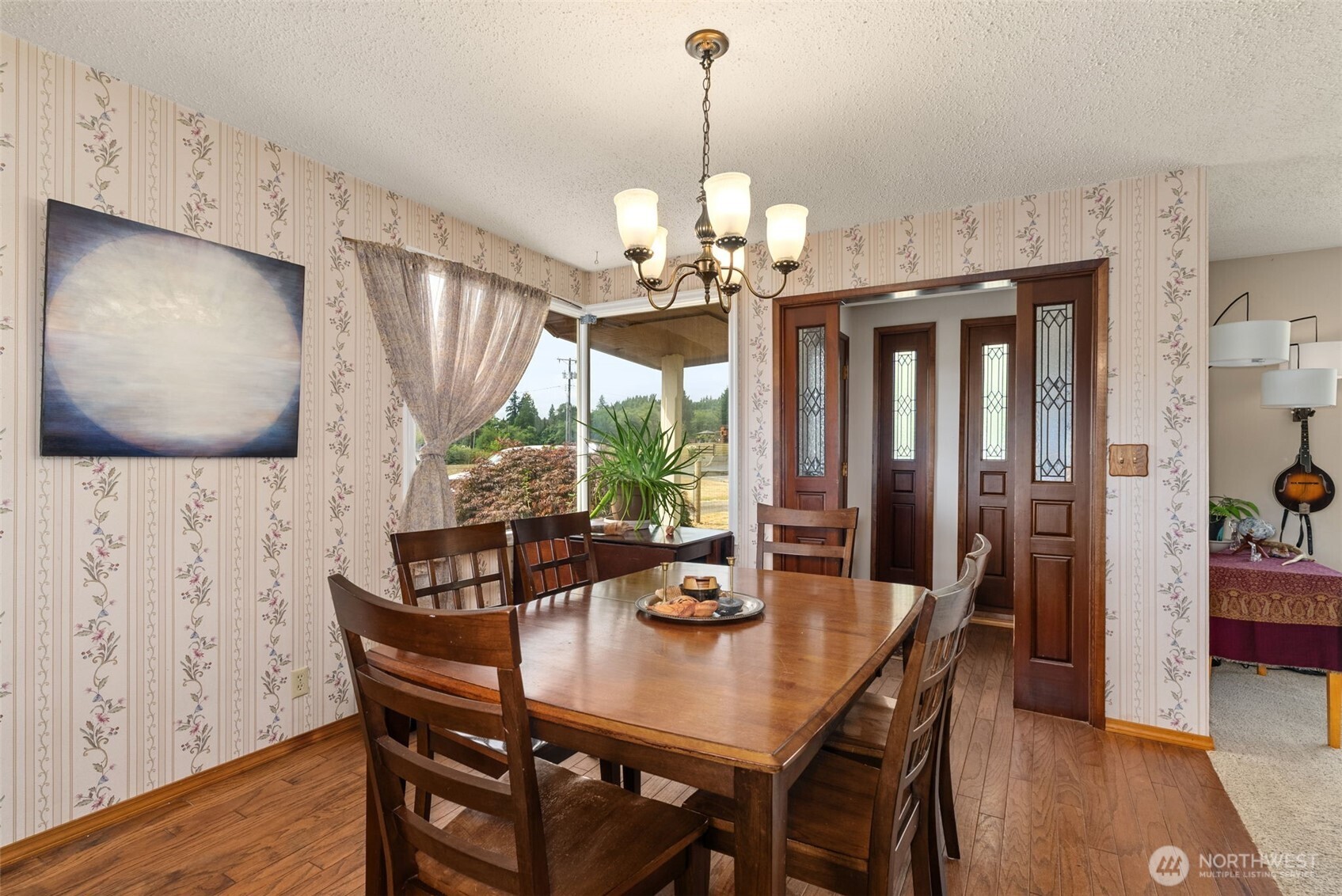 627 Wynoochee Valley Road Montesano, WA 98563 - Photo 27 of 40 a view of a dining room with furniture window and wooden floor