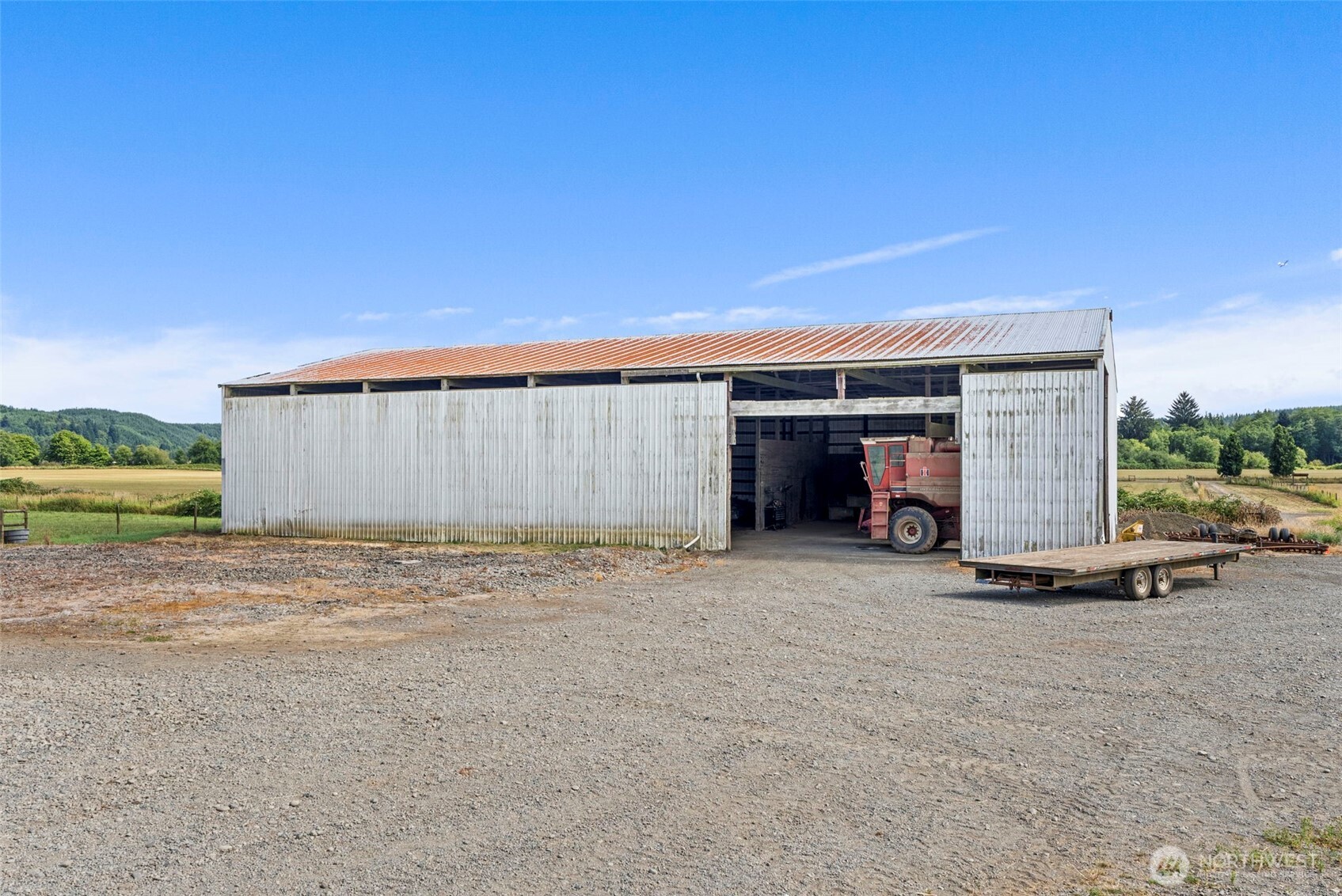 627 Wynoochee Valley Road Montesano, WA 98563 - Photo 10 of 40 a view of a house with backyard and a garage