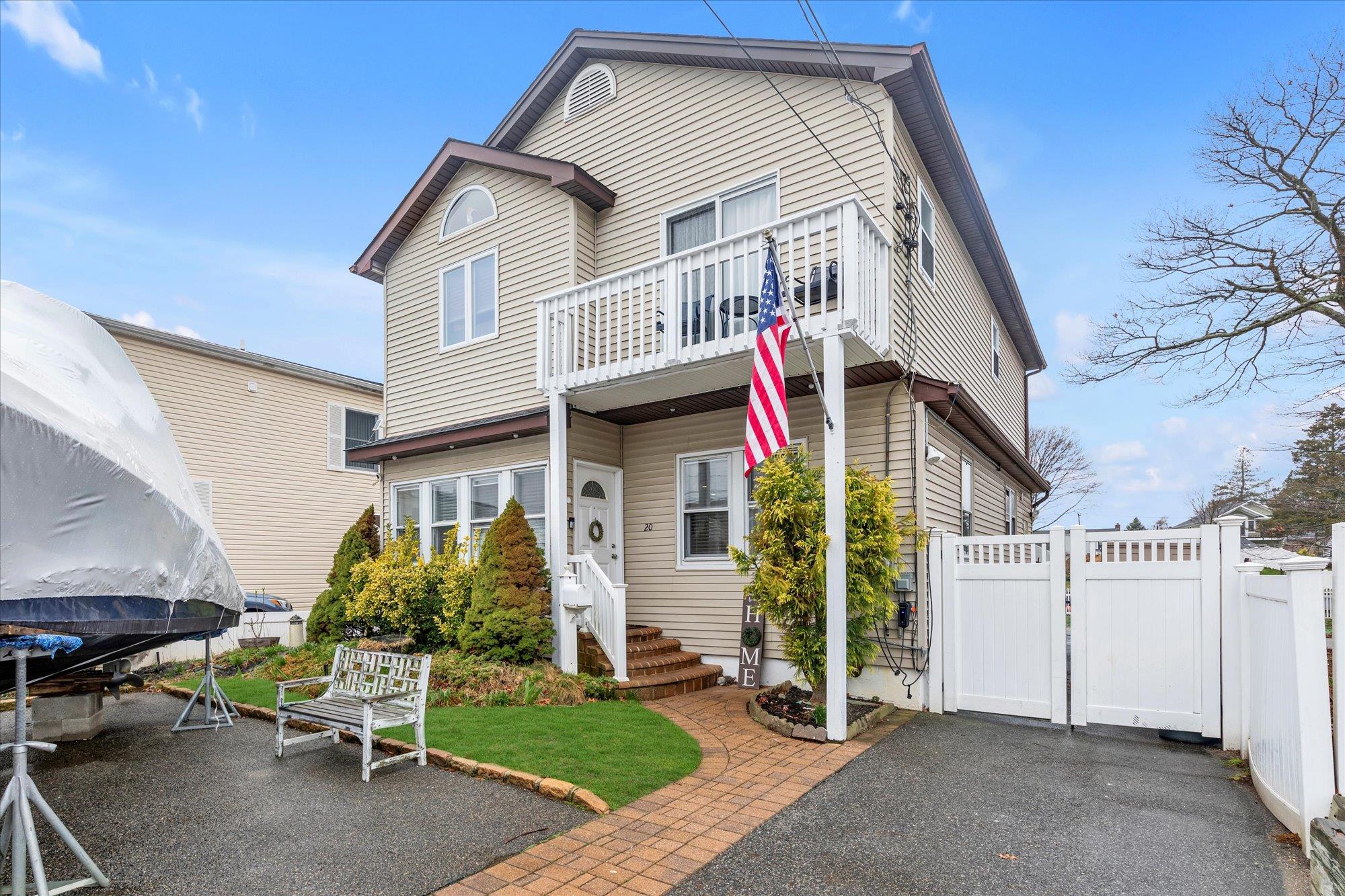 20 Beverly Road Wantagh, NY 11793 - Photo 1 of 1 View of front of house featuring a balcony, a gate, and fence
