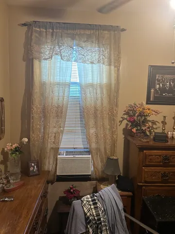 a bedroom with a bed and a mirror