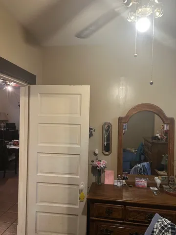 a bathroom with a mirror and a shower