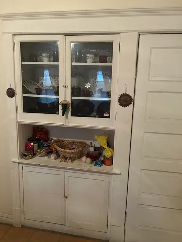 a kitchen with a refrigerator and a window