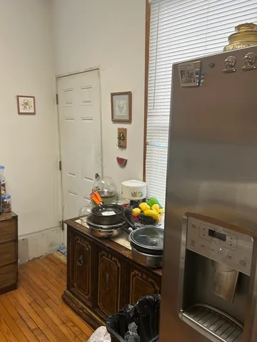 a bathroom with a sink a stove and cabinets