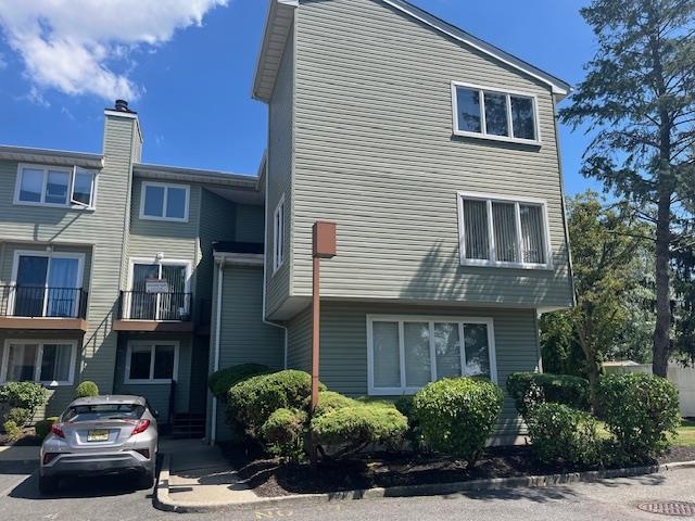 700 10th Street, Unit 12 Secaucus, NJ 07094 - Photo 12 of 13 a front view of a house with a yard