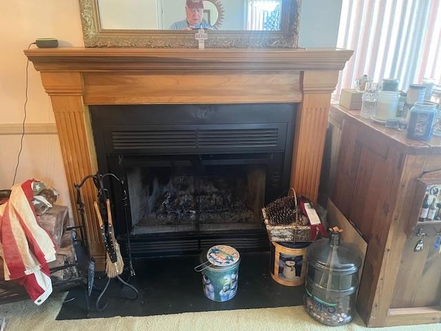 700 10th Street, Unit 12 Secaucus, NJ 07094 - Photo 3 of 13 a living room with a fireplace windows and book shelf