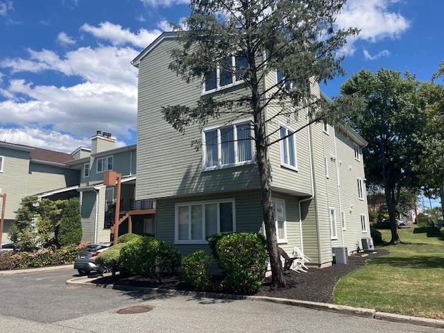 700 10th Street, Unit 12 Secaucus, NJ 07094 - Photo 10 of 13 a front view of a house with a yard