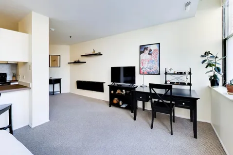 a view of a livingroom with furniture and a flat screen tv