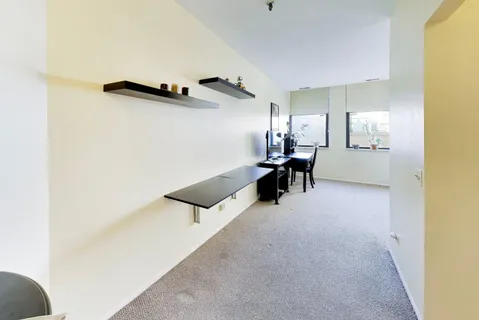 a kitchen with a sink cabinets and stainless steel appliances
