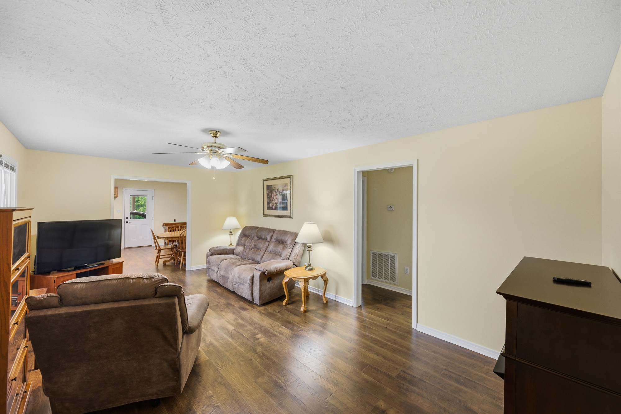 944 Brooksie Thompson Road Decaturville, TN 38329 - Photo 23 of 47 a living room with furniture and a flat screen tv