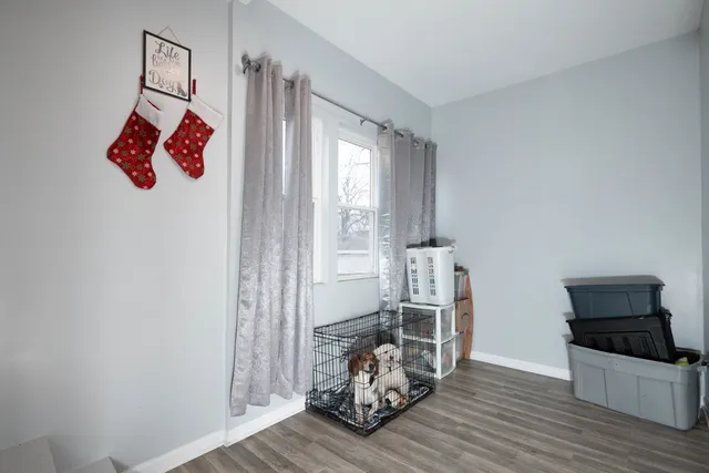 a room with furniture and wooden floor
