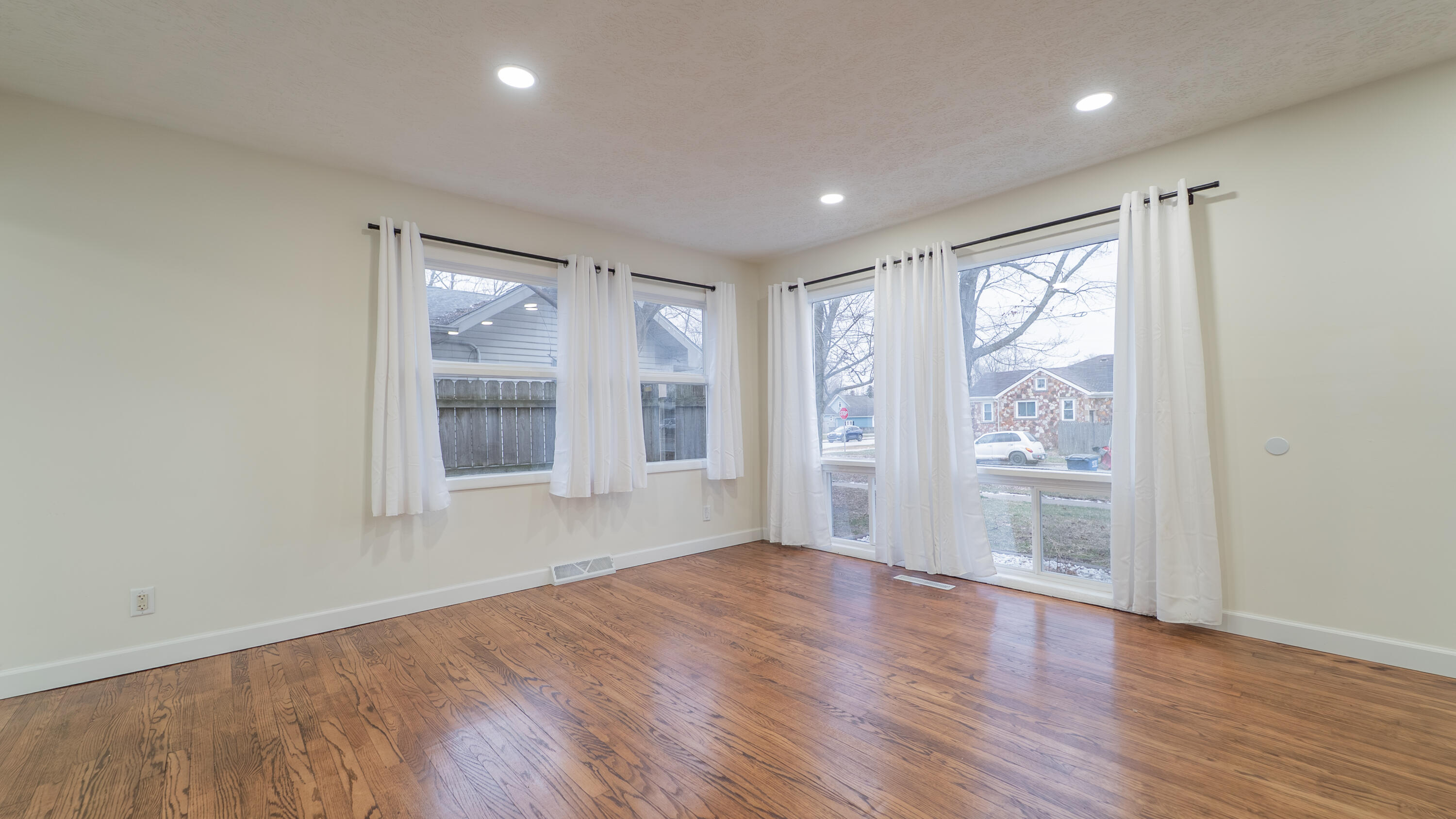 722 Madison Street Michigan City, IN 46360 - Photo 13 of 43 wooden floor in an empty room with a window