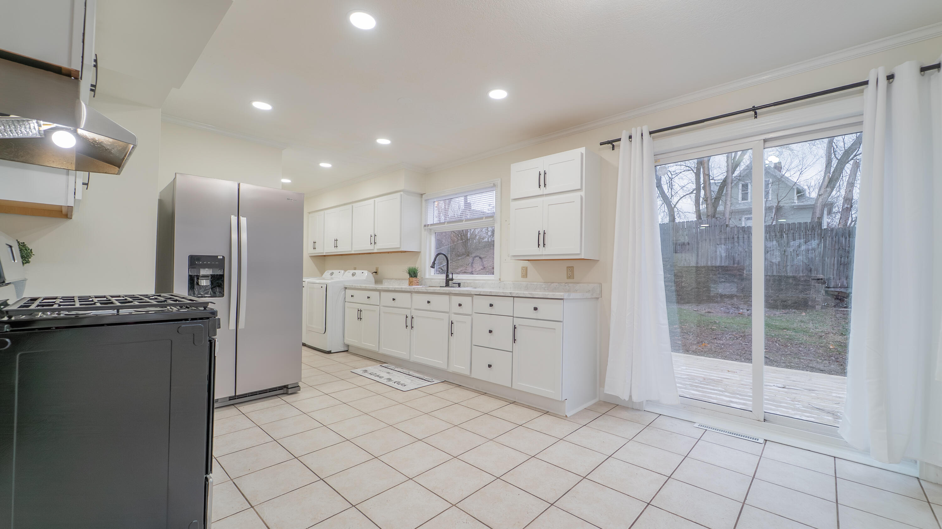 722 Madison Street Michigan City, IN 46360 - Photo 15 of 43 a kitchen with stainless steel appliances granite countertop a refrigerator and a stove top oven